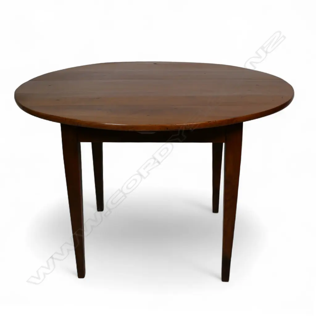 A French c.1900 fruitwood circular kitchen table, Image 1++